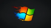 Logotipo dinâmico do Windows 10 com chamas coloridas em fundo escuro