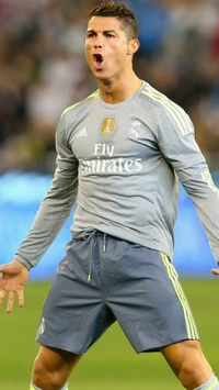 Cristiano Ronaldo comemorando um gol com o uniforme do Real Madrid