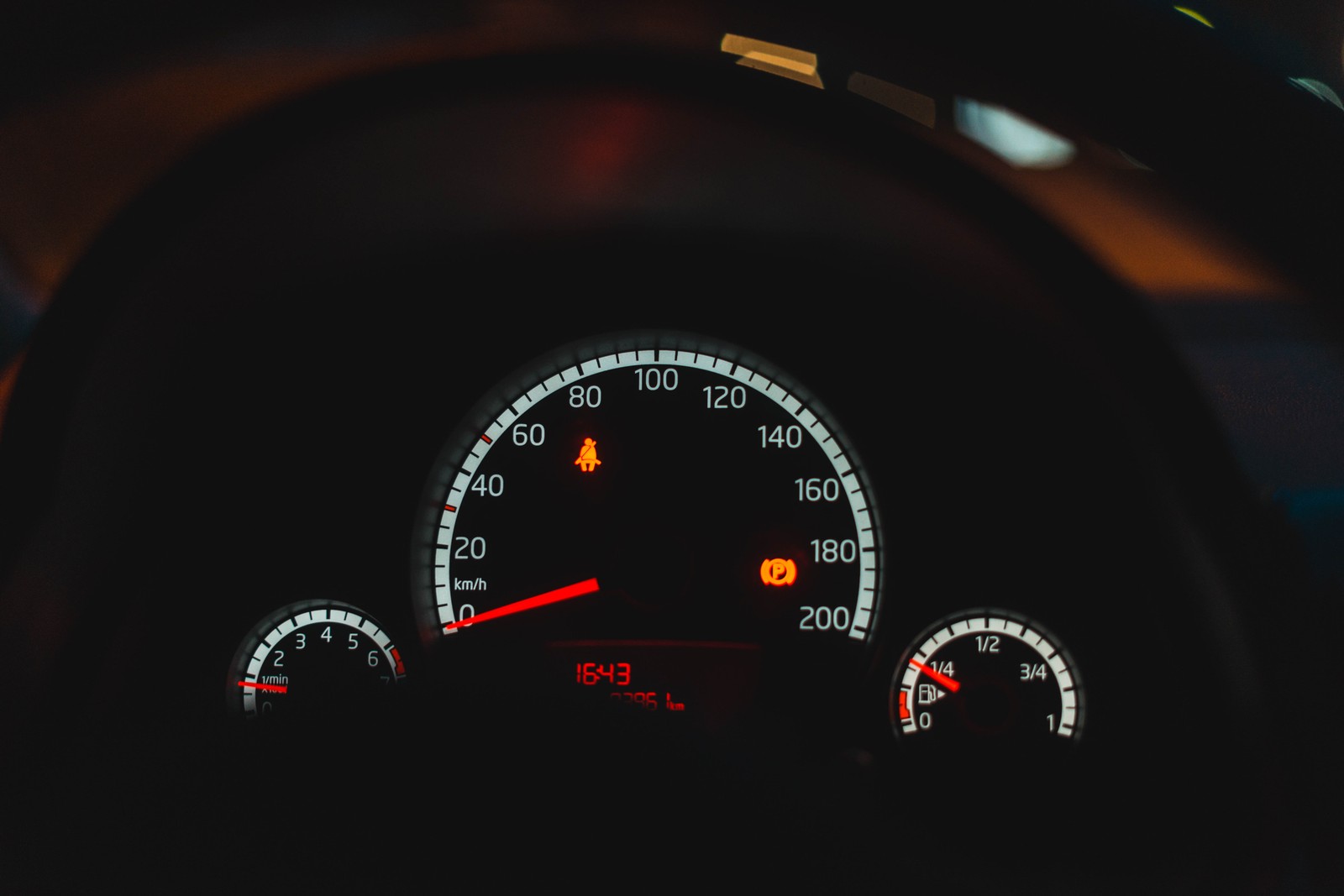 A close up of a car dashboard with a speedometer and gauge (volkswagen, car, volkswagen polo, speedometer, gauge)