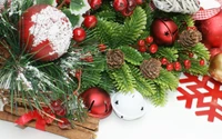 Festive Christmas Decorations with Ornaments, Pinecones, and Evergreen Accents.