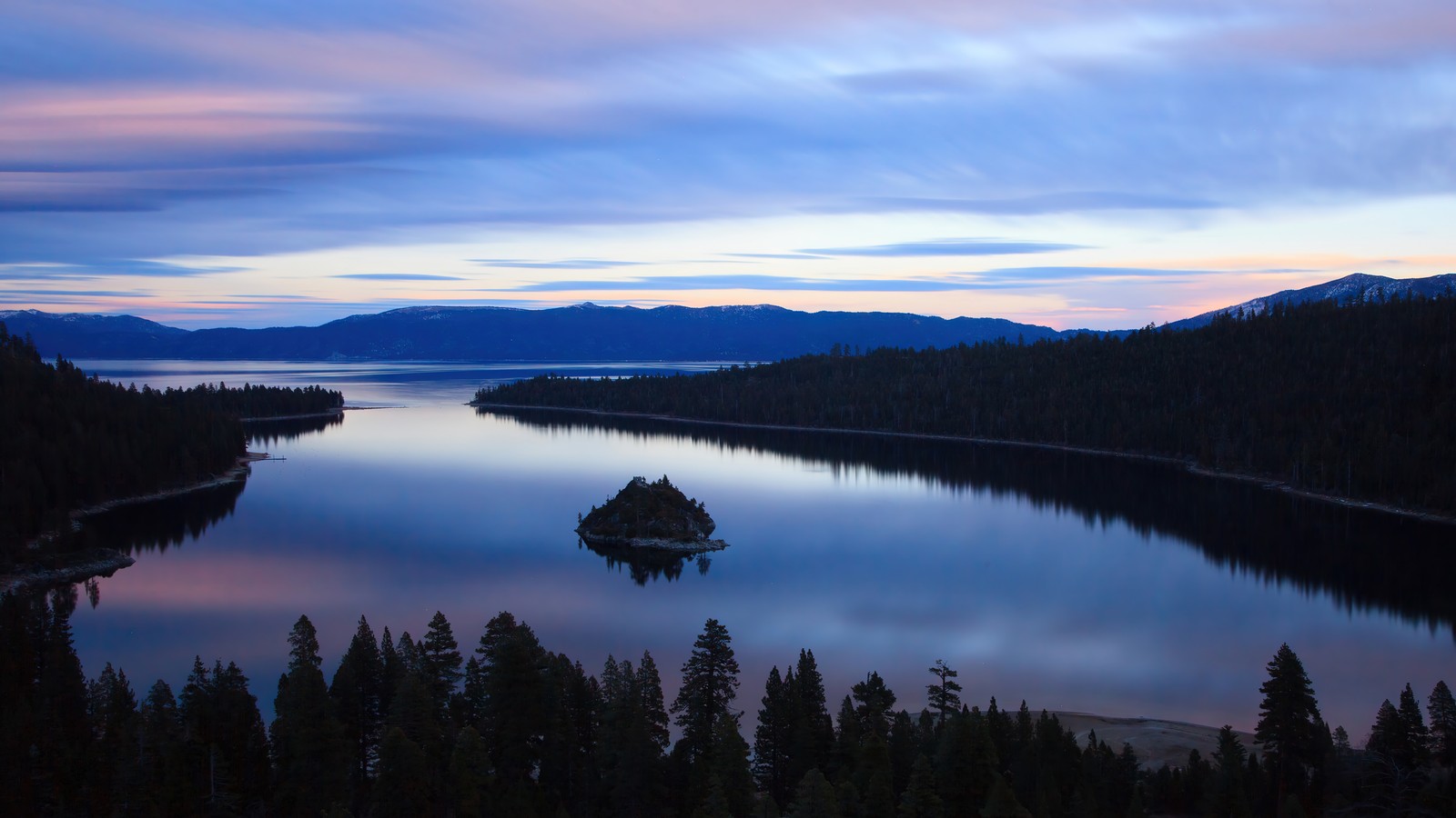 Arafed view of a lake with a small island in the middle (nature, forest, tree, scenery, sky)