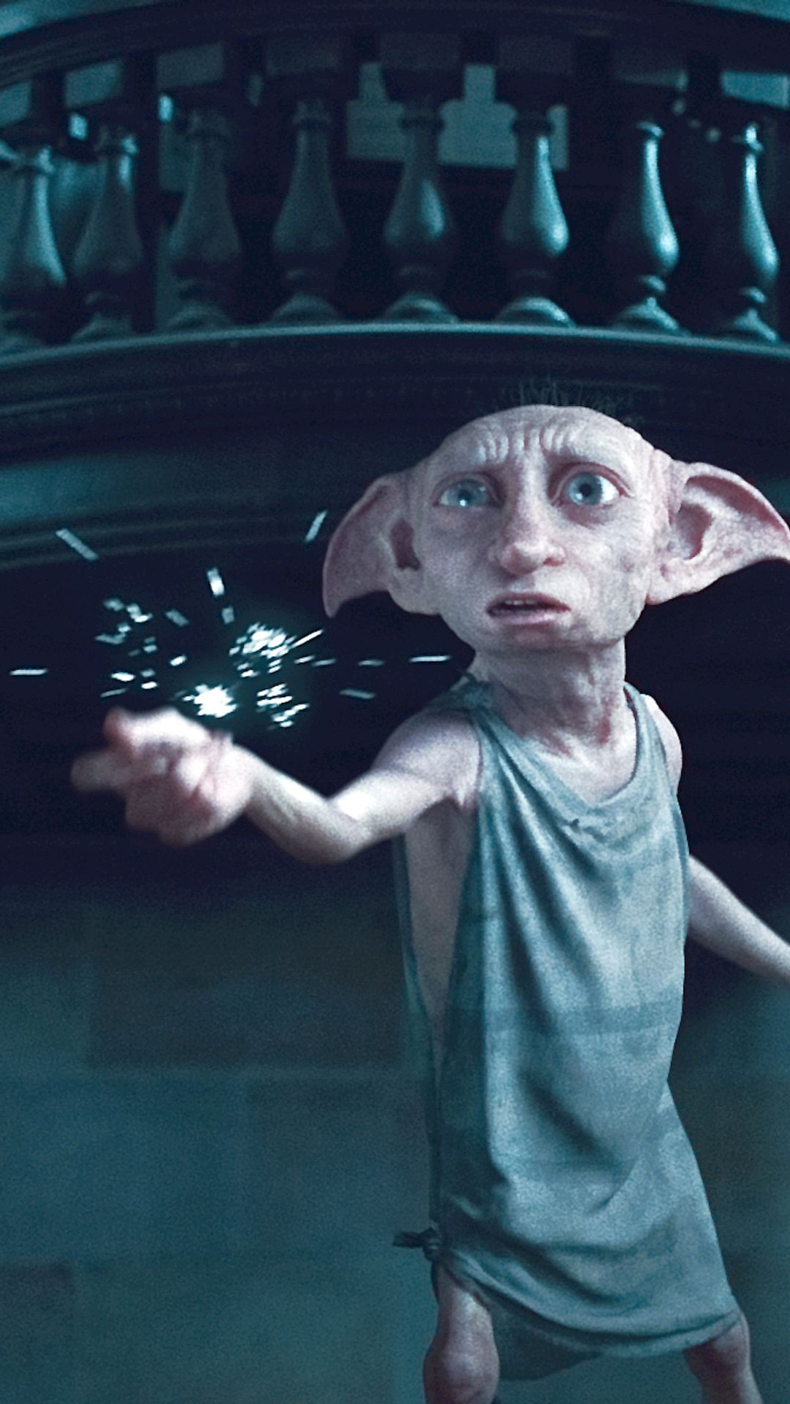 Harry potter is holding a sparkler in his hand (dobby, elf, harry potter)