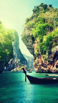 Serene turquoise waters embrace majestic cliffs and lush greenery, featuring a solitary boat amidst a magical landscape.