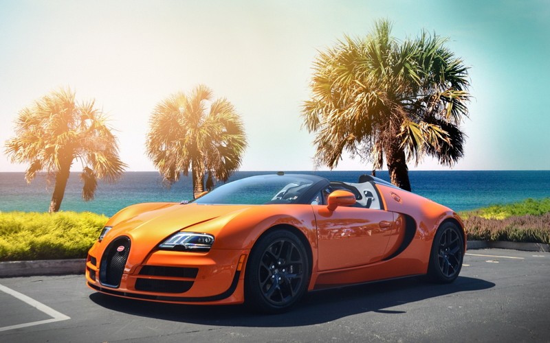 Крупный план багги, припаркованного на стоянке у океана (bugatti veyron, машина, спортивный автомобиль, суперкар, спортивная машина)