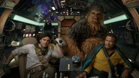 Lando Calrissian, Poe Dameron, and Chewbacca aboard the Millennium Falcon in Star Wars: The Rise of Skywalker.