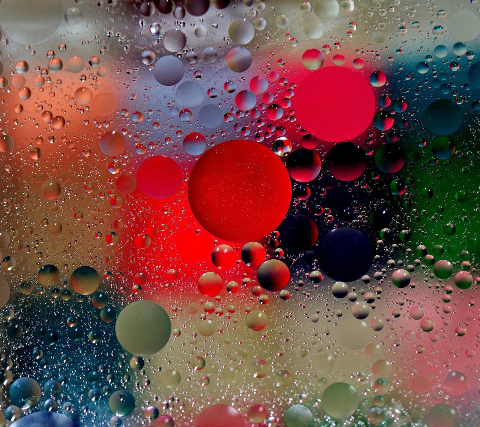 A close up of a bunch of bubbles in a glass (air, bubbles, colors, drops, glass)