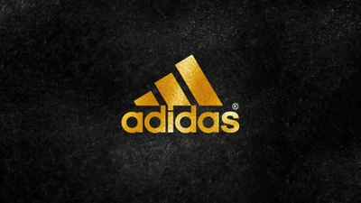 Goldenes Adidas-Logo auf dunklem Hintergrund - 4K Hintergrundbild