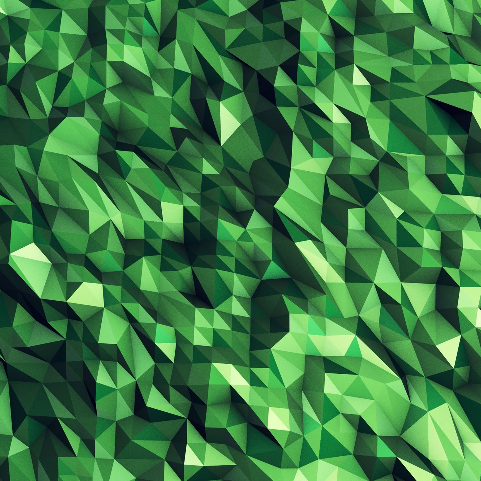 Un gros plan d'un fond abstrait vert avec des triangles (polygone, vert, motif, feuille, design)