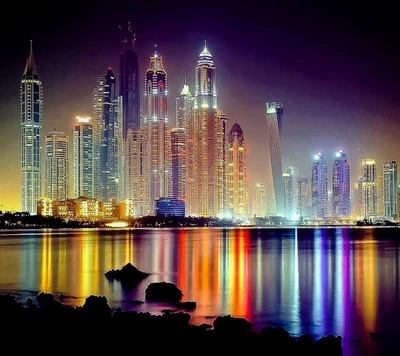 Dubai's Nightscape: Illuminated Skyscrapers Reflected in the Sea