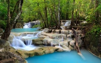 Erawan Waterfall: A Serene Oasis of Cascading Waters and Lush Greenery