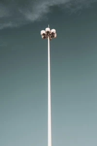 Illuminated Street Light Against a Cloudy Sky