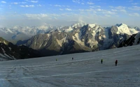 Explorers Navigating a Snow-Covered Alpine Terrain