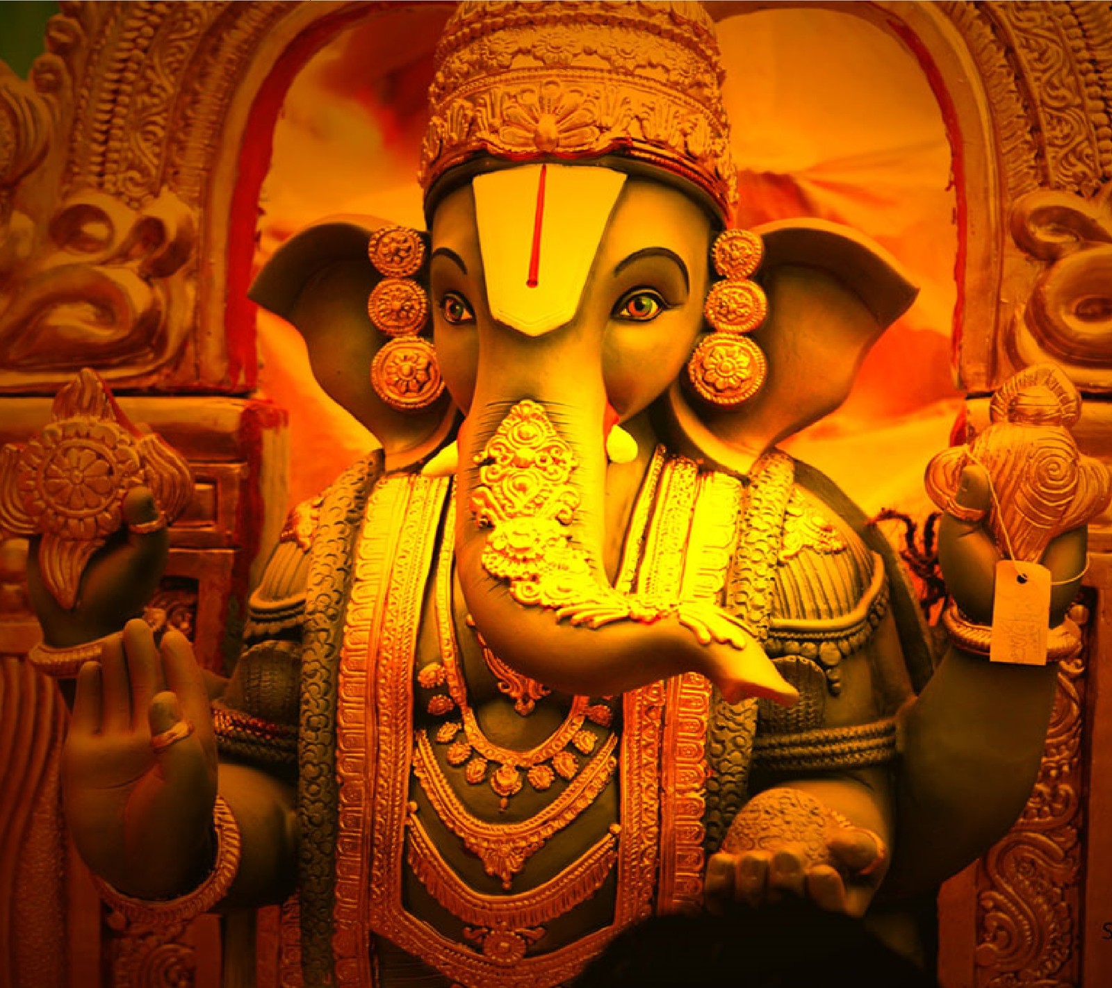 There is a statue of an elephant with a crown on it (aditya, bappa, ganesh, ganpati, god)