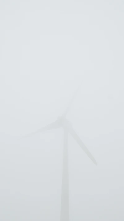 Foggy Landscape with Windmill in Monochrome