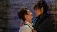 A tender moment between two characters in "Tick, Tick... Boom!" featuring Andrew Garfield and Alexandra Shipp.