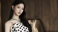 Miyeon from (G)I-DLE in a polka dot dress, exuding elegance and charm.