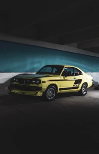 Classic Yellow Mazda Coupe with Tuning Accents in Urban Setting