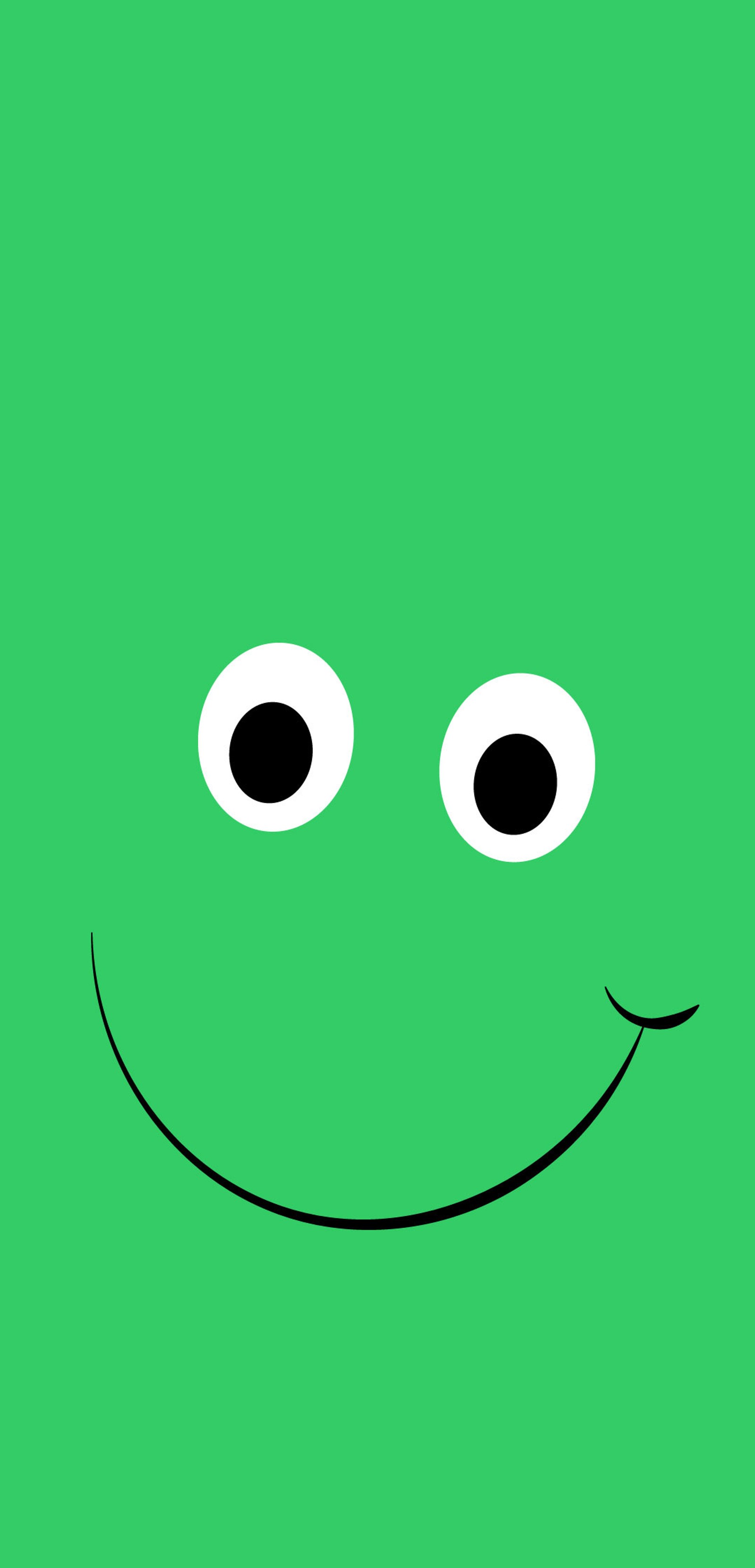 A close up of a green face with two big eyes (green, happy, face, vector, fun)