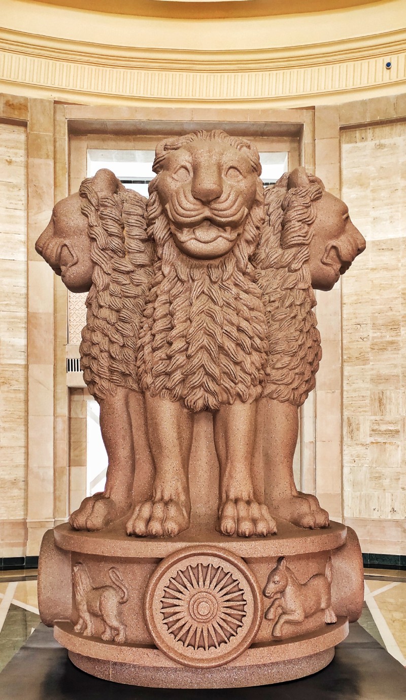 There is a statue of a lion with a lion head on it (constitution, government)