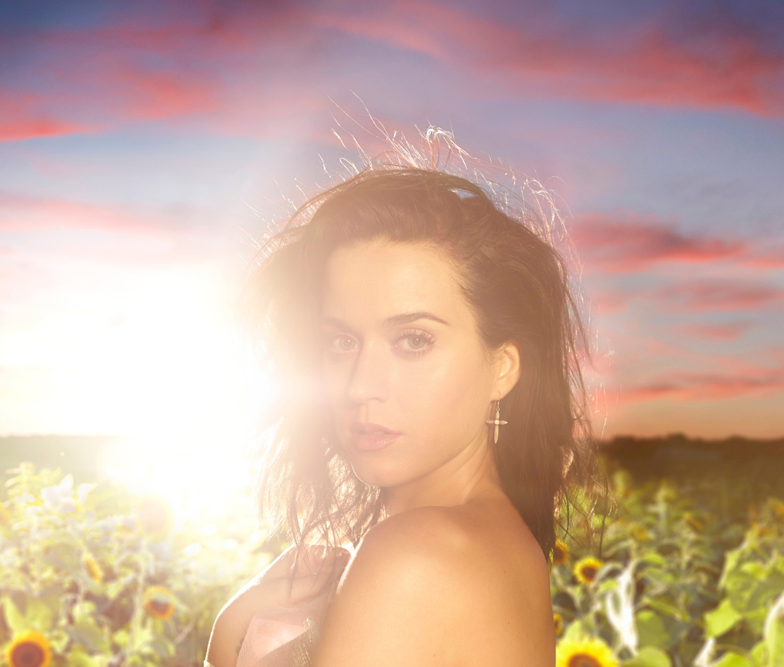 Arafed woman in a field of sunflowers with the sun setting (katy perry, 8k, 5k, american singer, music)