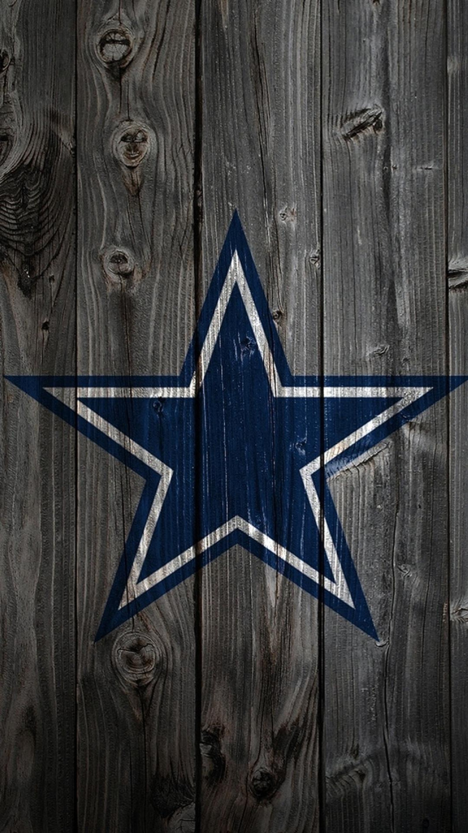 Arafed photograph of a wooden fence with a star painted on it (cowboys, dallas, dallas cowboys, star, texas)