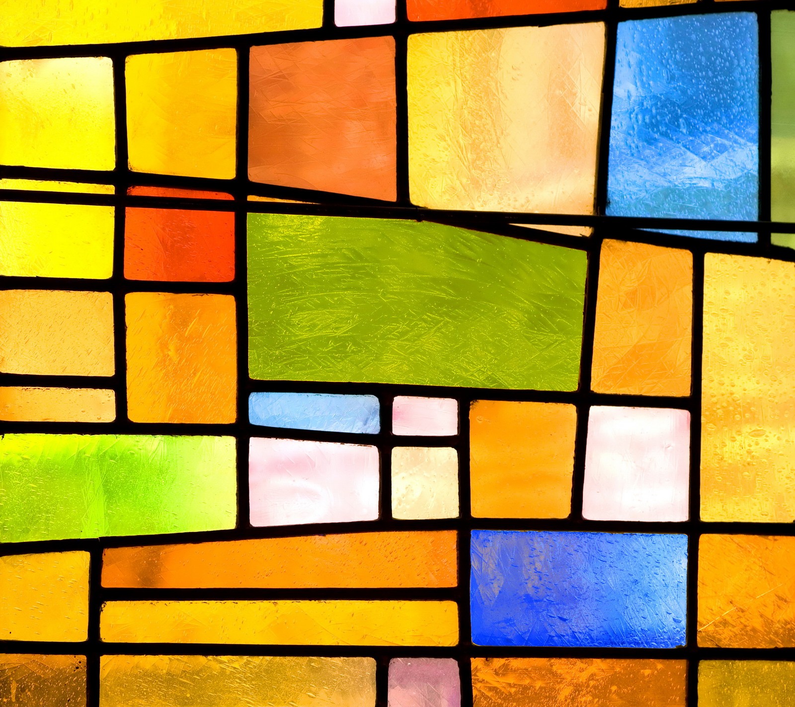 A close up of a stained glass window with a yellow and blue background (colorful, glass, mosaic, stained, window)