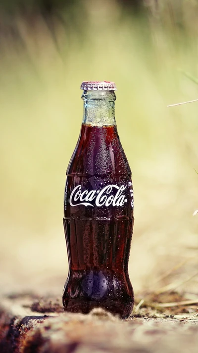 Chilled Coca-Cola Bottle in Natural Setting