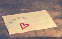 Wooden Table with a Love Letter and Heart Accent