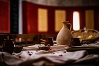 Rustic Still Life with Earthy Dishware and Textiles in a Cozy Setting