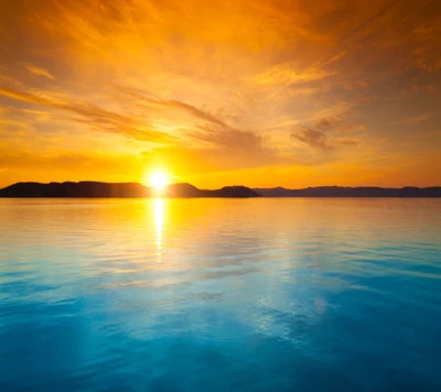 Vibrant Sunrise Over Tranquil Ocean Waters