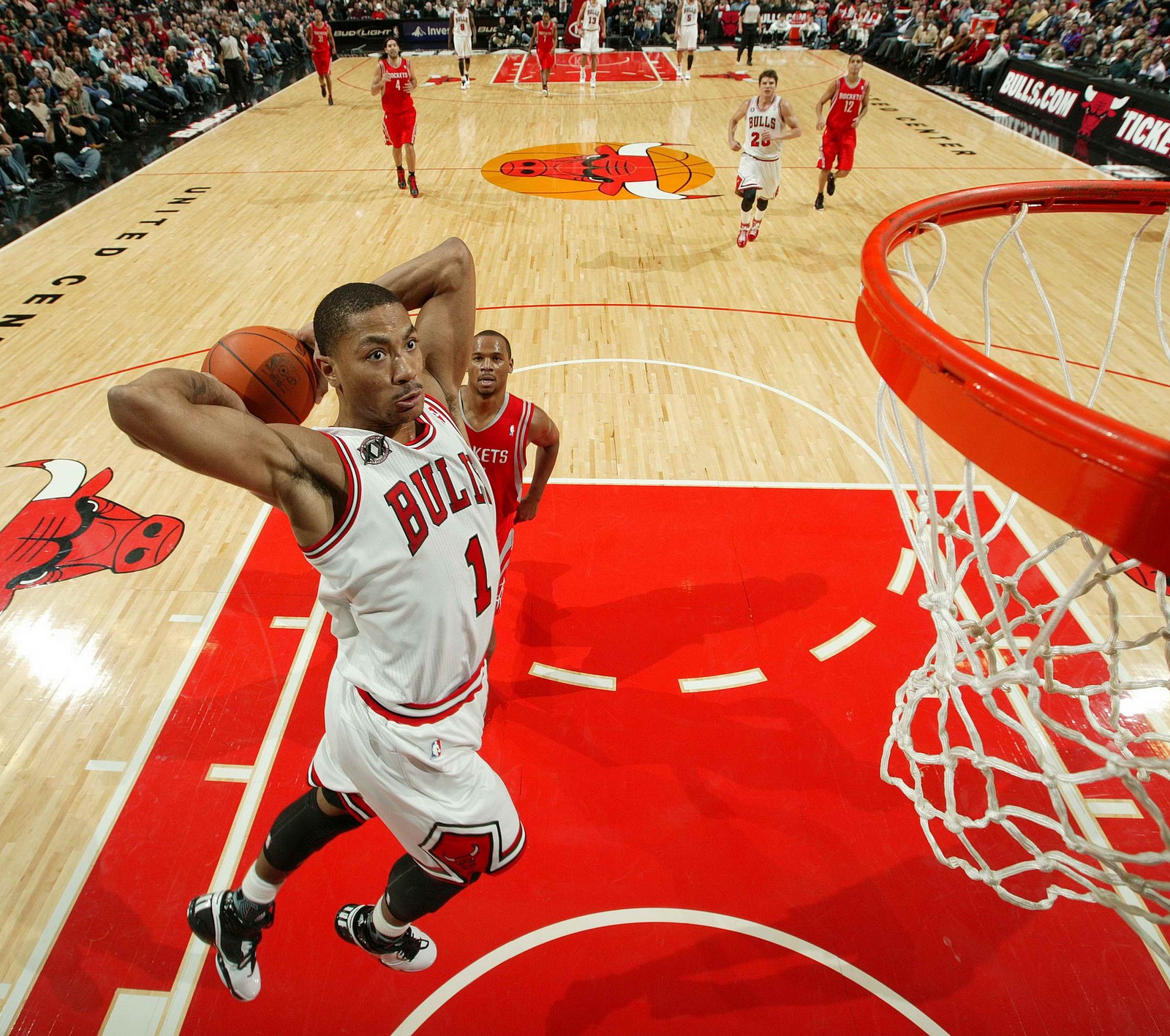 Arafed shot of a basketball player taking a shot at the basket (bulls, chicago, derrick, derrick rose, dunk)