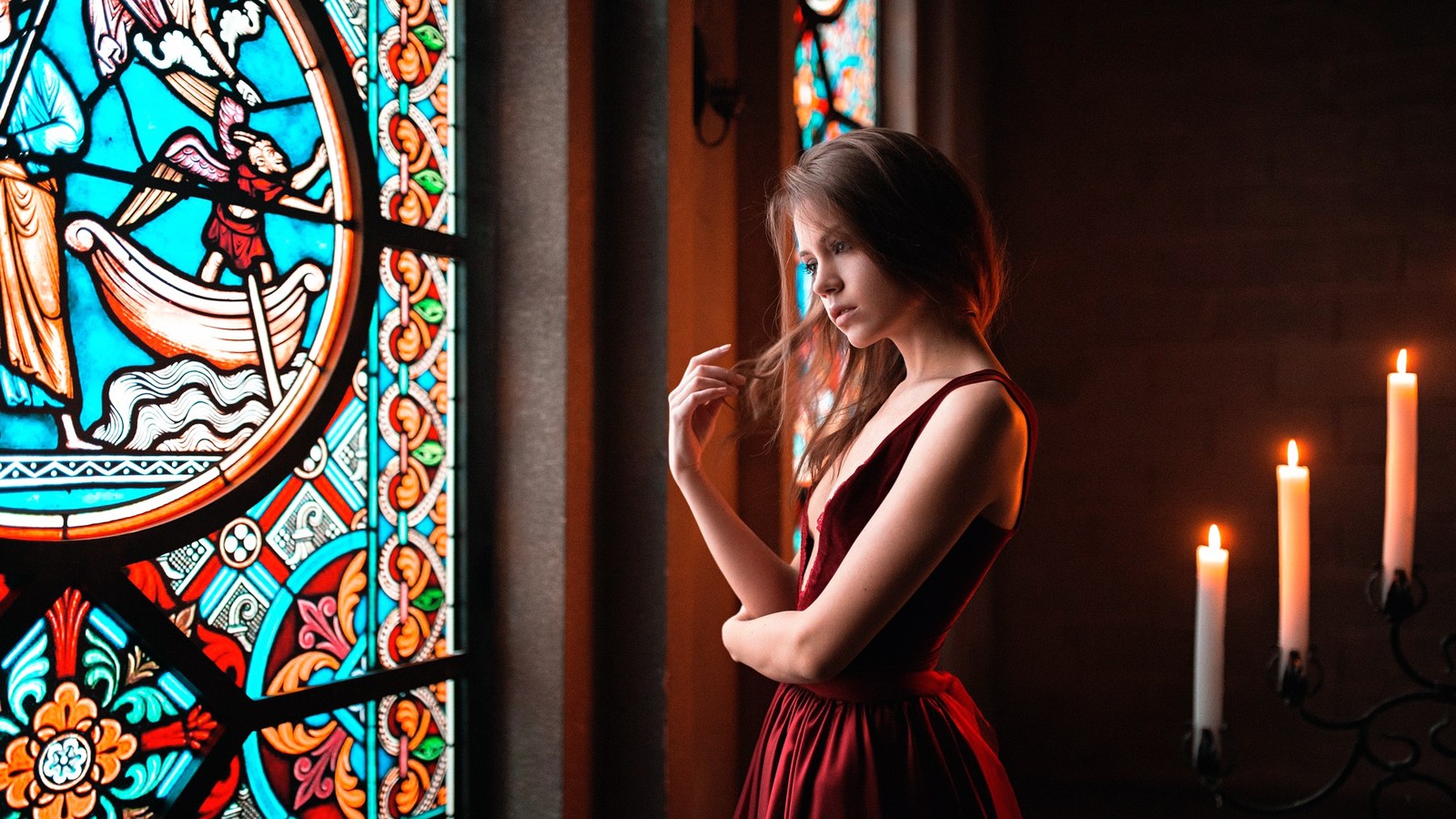 Arafed woman in a red dress standing in front of a stained glass window (stained glass, glass, window, lighting, dress)