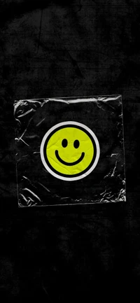 Yellow Smiley Emoticon on a Grey Background