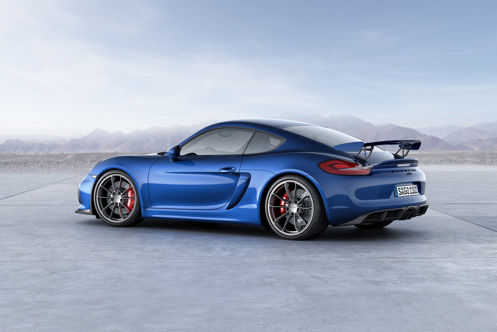 A blue porsche cayman is parked on a concrete surface (porsche cayman, porsche 911 gt3, porsche, sports car, 2016 porsche cayman gt4)