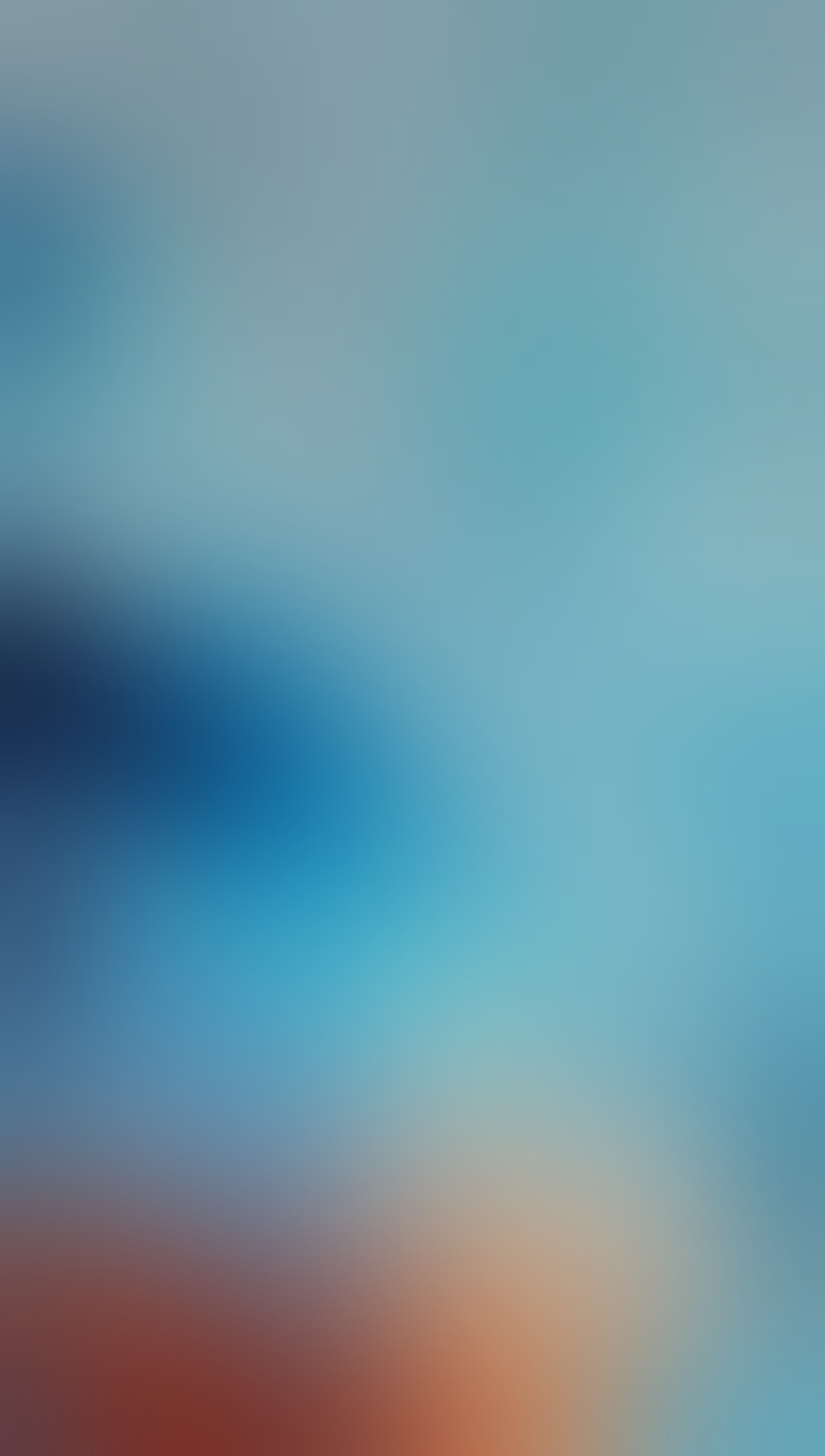 There is a blurry photo of a blue and orange object (abstract, blue, blur, colorful)