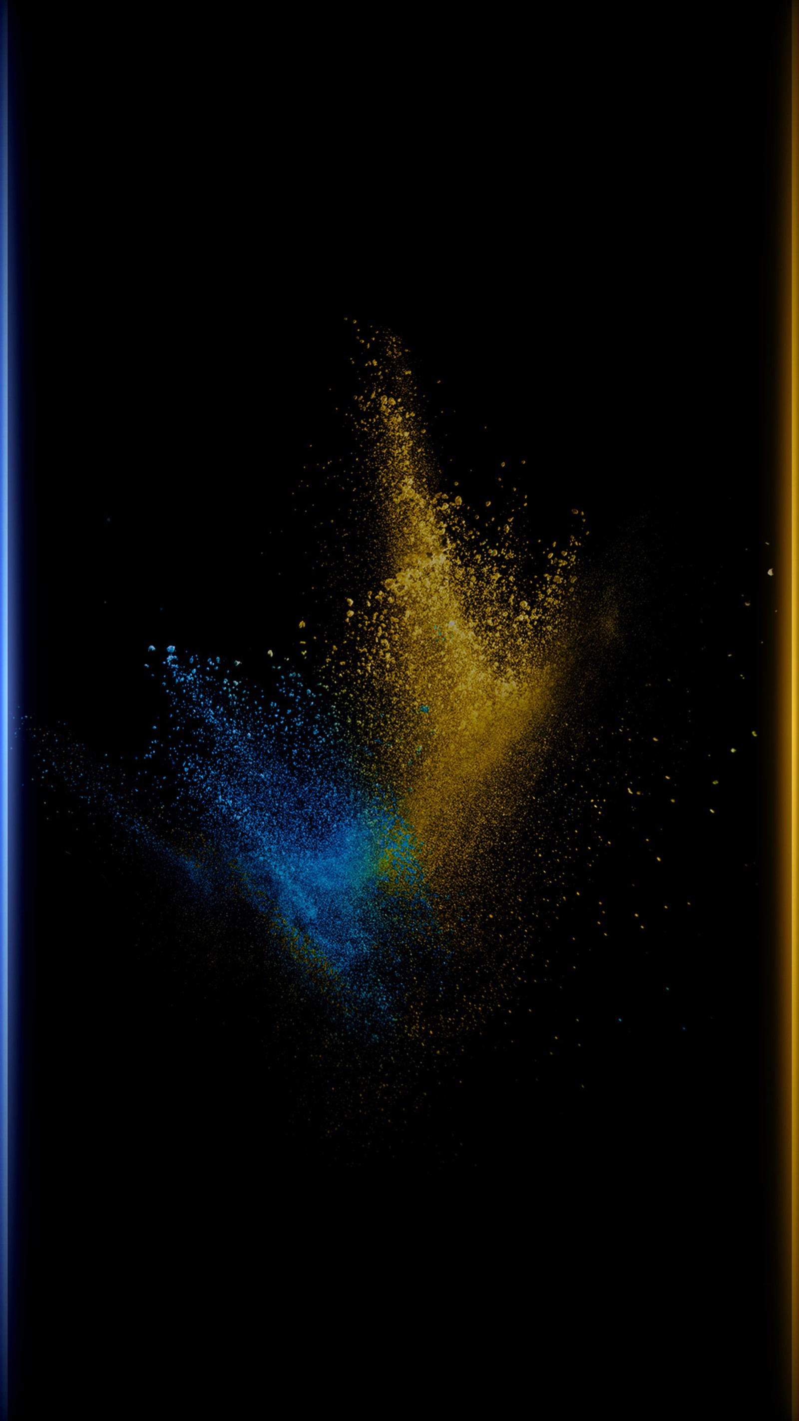 Imagem borrada de uma explosão de pó azul e amarelo na escuridão. (abstrato, preto, azul, colorido, estilo de borda)