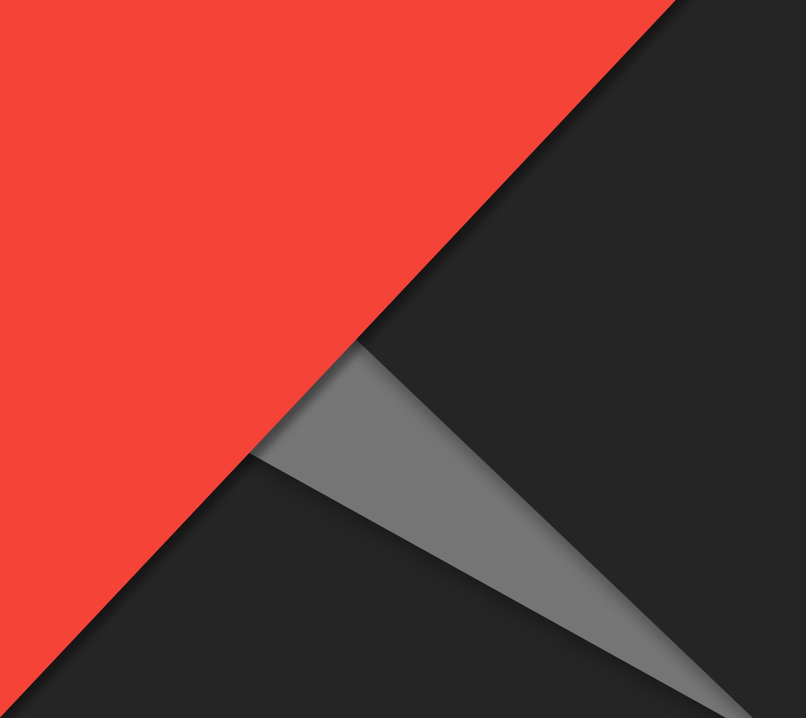 A close up of a red and black wall with a gray triangle (colors, flat, material, shapes, triangles)