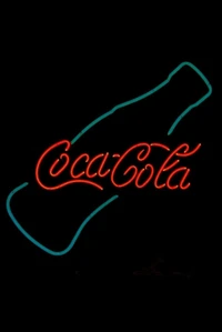 Panneau néon Coca-Cola dans le paysage nocturne du Texas