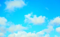 Tranquil Azure Sky with Soft Cumulus Clouds