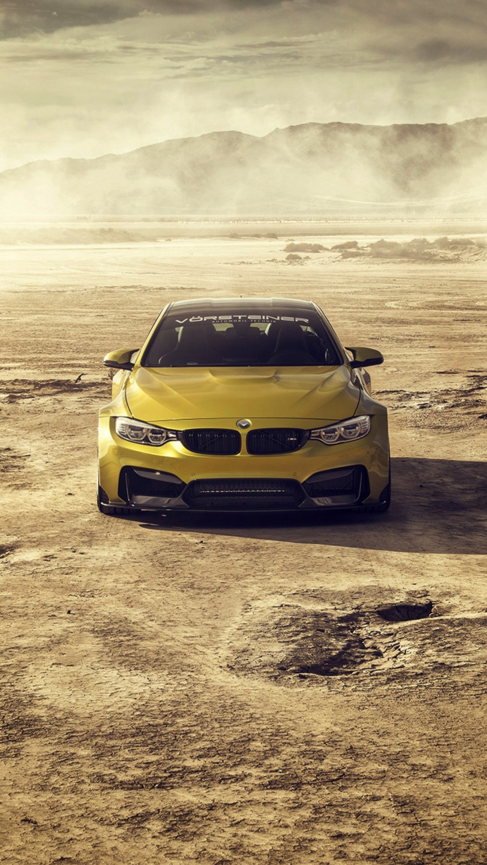 Arafed yellow car in a desert with a mountain in the background (bmw, car, coupe, f82, front view)