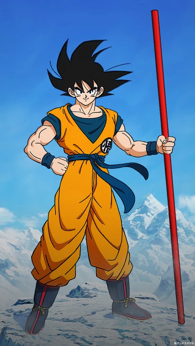 Goku in seinem ikonischen orangefarbenen Gi, der einen Stab vor einer bergigen Kulisse schwingt.