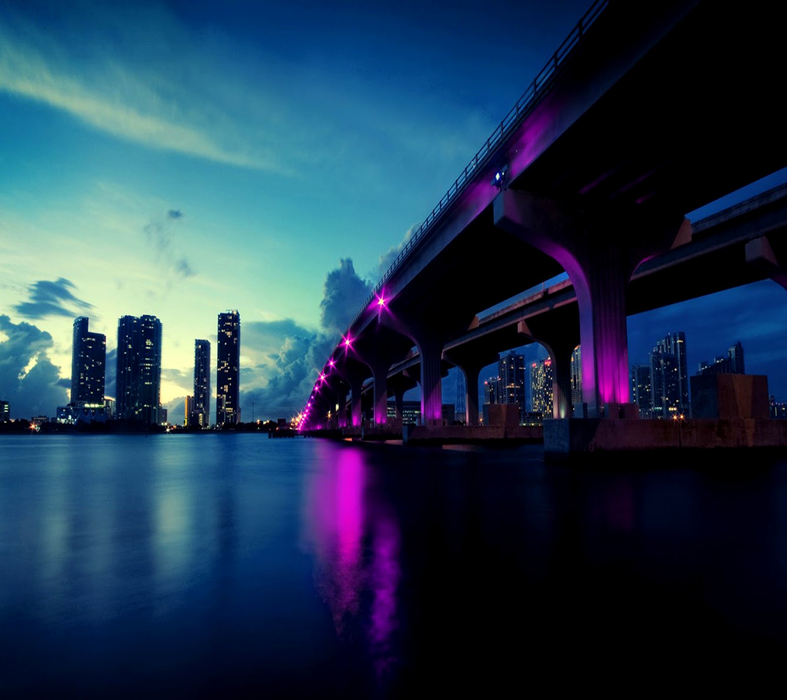 Arafed view of a bridge over a body of water with a city in the background (android, nature)