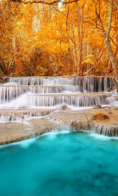 Autumn Serenity: Cascading Waterfalls in a Vibrant Forest