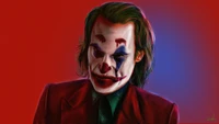 Joaquin Phoenix as the Joker in a striking portrayal with a vibrant red backdrop.