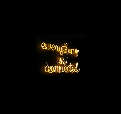 Everything is Connected: A Neon Quote on Black