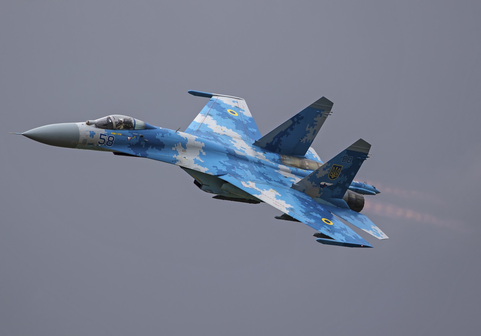 There is a blue fighter jet flying through the air (russian air force, aircraft, airplane, fighter aircraft, military aircraft)