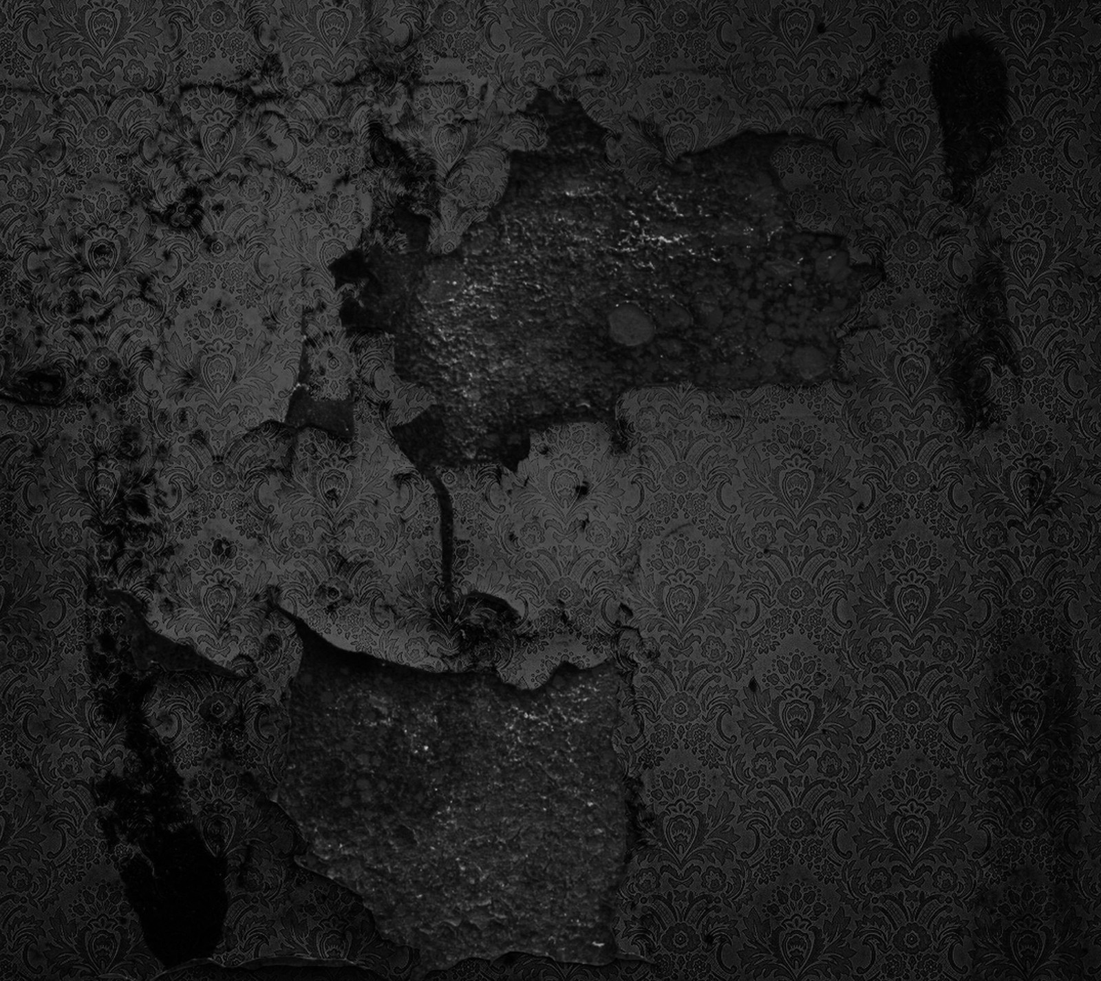 A close up of a black and white photo of a wall (dark, gray, wall)