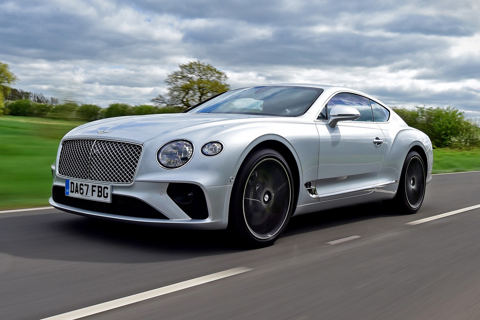 A close up of a silver bentley car driving on a road (bentley continental gtc, bentley, car, grand tourer, bentley continental gt)