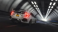 Honda Integra in a dynamic tunnel setting, showcasing its sleek design and automotive lighting.