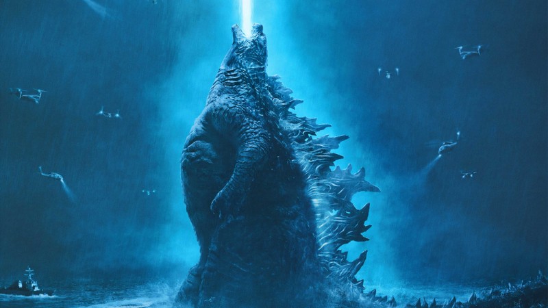 Годзилла поднимается из океана с лучом света, падающим на него (годзилла, godzilla, гадзилла король монстров, фильм)